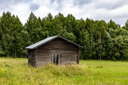 Leksand, Sweden An old weathered barn in a field.