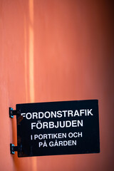 Stockholm, Sweden A sign in a resdiential courtyard says in Swedish translation: Vehicle traffic forbidden in the portal and the yard.