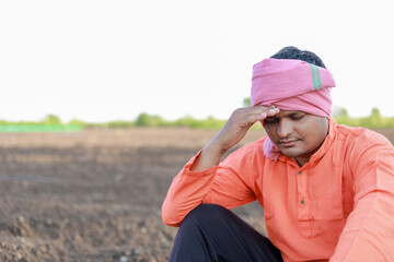 Happy Indian farmer, young sand farmer , loss in farm