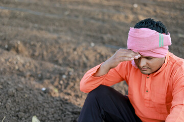 Happy Indian farmer, young sand farmer , loss in farm