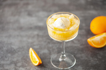 Homemade orange creamsicle in glass. Frozen orange juice with ice cream. Summer dessert.