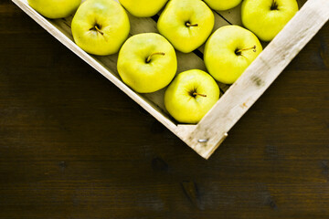 Fresh apples in wooden box
