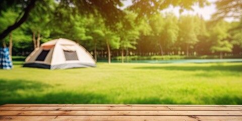 Relaxing holiday. Travel and camping adventure lifestyle in park with outdoor tent and wooden table on blur background