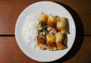 Kue putu, a traditional Indonesian snack made from rice flour filled with palm sugar and grated coconut as topping
