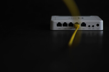 Modern dual band wireless router. Man working in the background. Fast and wireless internet concept.