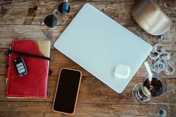 notebook, laptop and phone, headphones, cocktail, sunglasses in table, Pretty Young Beauty Woman...