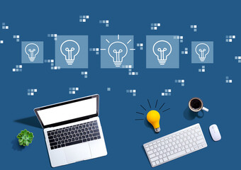 Idea light bulb theme with computers with a light bulb from above