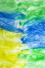 Obraz premium Plastic bags as texture background, conscious lifestyle concept, photo backdrop. Single-use plastic ban. Eco trend to reduce disposable plastics, top view Biodegradable packaging waste, bio packets