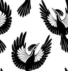 Seamless vector pattern of woodpeckers silhouettes. Texture with black stylized bird on white background. Surface design. Ornithology background