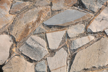 Fototapeta premium a Stone wall pattern back ground day time Jan 1 2016