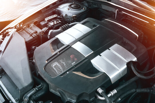 Horizontally opposed 6-cylinder engine under the hood. Under the hood of a sports car. Powerful engine closeup. Clean motor block.