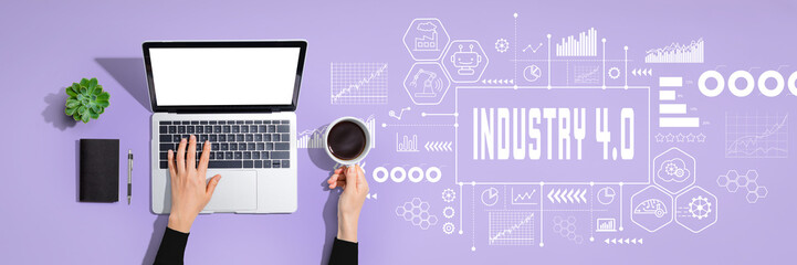 Industry 4.0 theme with person using a laptop computer