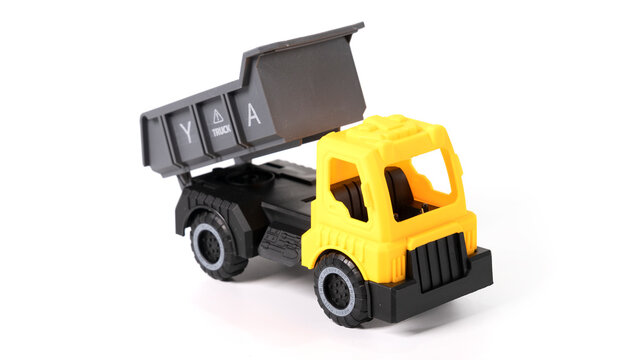 Model of toy dumper truck isolated on white. 