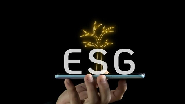 Businessman showing smart phone with ESG icon and virtual tree. Net zero greenhouse gas emissions target. Climate neutral long term strategy. Ecological, renewable energy and save environment concept.