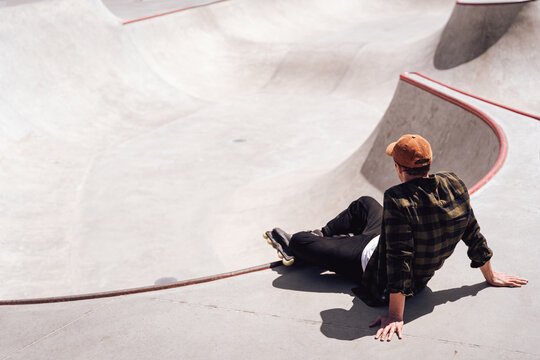 aggressive roller skater chilling in skatepark