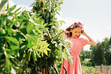 young girl helping decorate the midsummer pole in Sweden