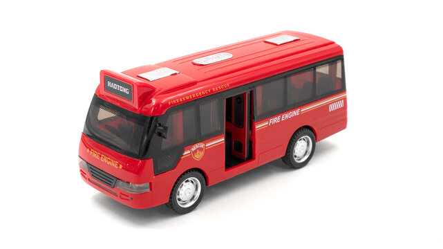 Red plastic bus toy isolated on white background