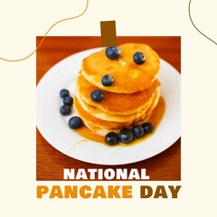 National pancake day text in white and brown with pancake stack on plate with blueberries and syrup