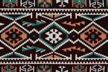 Traditional Turkish carpet and kilim motifs. There are geometric motifs on a black background.