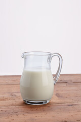jug of milk on wooden rustic table