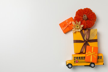 Fall semester season concept with school bus and fall accessories
