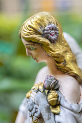 Close-up of antique angel statues.