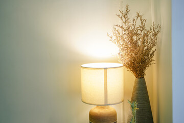 White table lamp and dry flowers pot in the living room. Copy space
