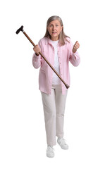 Angry senior woman with walking cane on white background