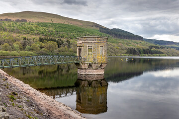 Fototapeta na wymiar The draw-off tower at Talybont Reservoir in the Brecon Beacons National Park in Wales.