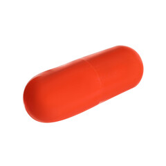 One orange pill on white background. Medicinal treatment