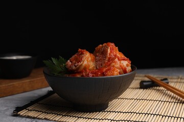 Delicious stuffed cabbage rolls on grey table, space for text