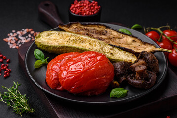 Delicious grilled vegetables zucchini, eggplant, peppers and mushrooms with salt, spices and herbs