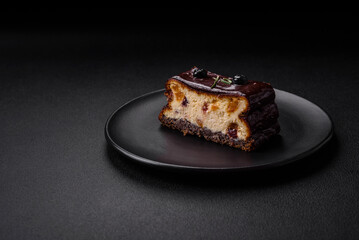 Delicious sweet dessert cheesecake with candied fruits in chocolate