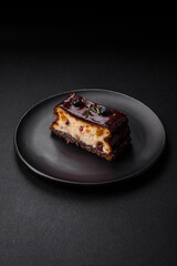 Delicious sweet dessert cheesecake with candied fruits in chocolate