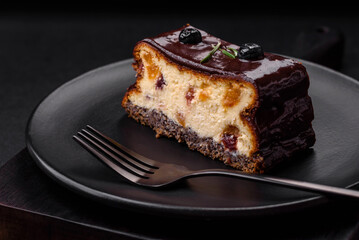 Delicious sweet dessert cheesecake with candied fruits in chocolate