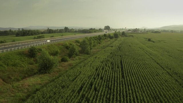 4K aerial video from above with A1 highway road between Sebes and Deva. Drone video with the roads of Romania. Aerial view during sunset after a summer storm.