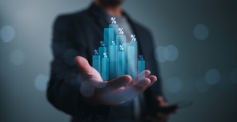 Businessman, investor, trader holding graph with percentage for investment profit, business growth,...