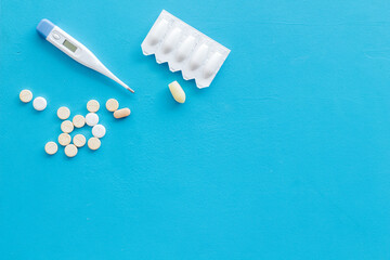 Thermometer with rectal suppositories and pills for medical treatment