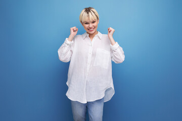 young funny caucasian blonde secretary woman dressed in a white shirt laughs on the background with copy space. people lifestyle concept