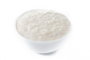 Fototapeta na wymiar Rice pudding. Arroz con leche. Rice pudding in white bowl isolated on white background.