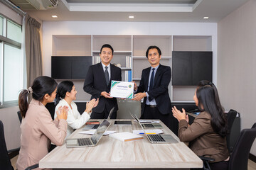 Business executives congratulate employees on their excellent work, Business people teamwork.