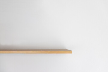 Empty wooden wall shelf on white background. - 624697921