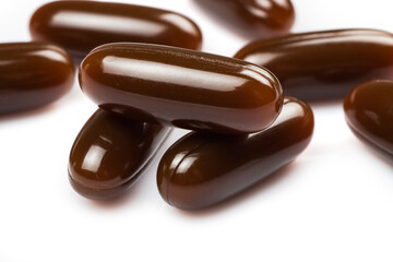 Lecithin gel pills capsule on white background. Soy lecithin benefits for skin, digestion, lower cholesterol.