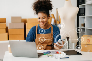  African Woman using a laptop, smartphone and tablet and writing notebook at the modern office of her business online shopping. In home with virtual icon