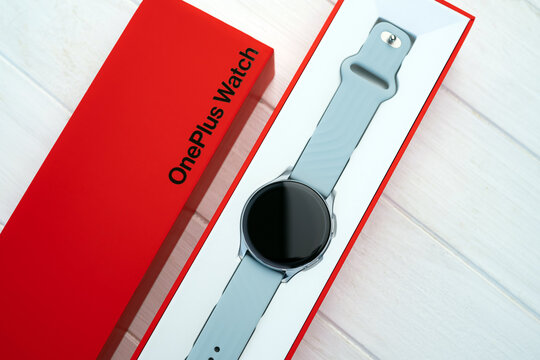Kharkiv, Ukraine - 12 January 2022: Smart watch Oneplus with red original box. Future modern digital gadget with innovations