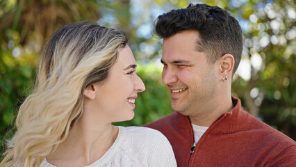 Man and woman couple smiling confident standing together at park