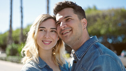 Man and woman couple smiling confident standing together at park