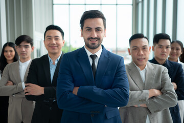 Group of business people standing in line in conference room used for meeting in modern office