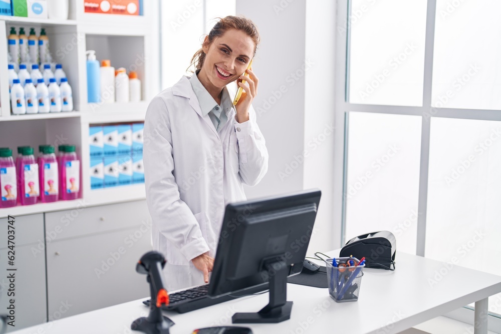 Sticker young woman pharmacist talking on smartphone using computer at pharmacy