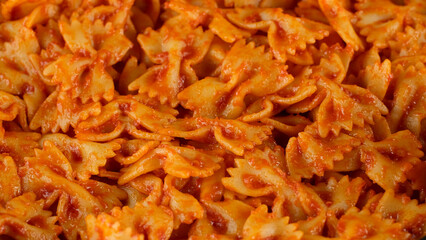 Grated cheese on pasta. Cooking traditional italian dinner